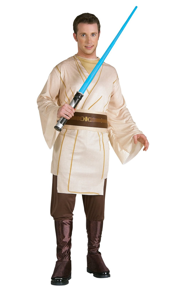 A person wearing a Jedi Knight costume, consisting of a beige tunic with brown trim, attached boot tops, and a belt with a lightsaber.
