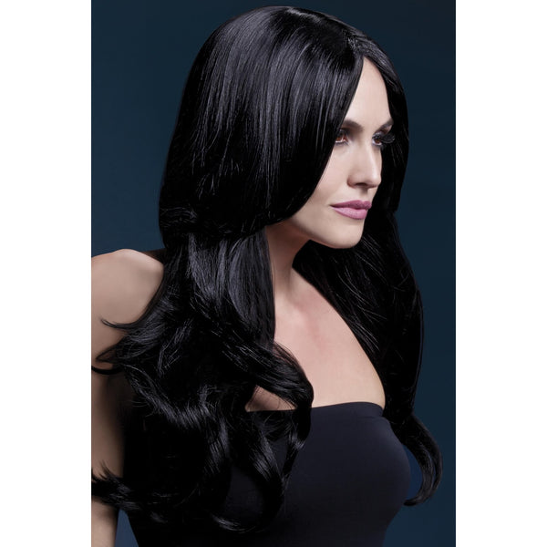 Woman with a long black wig against a dark background
