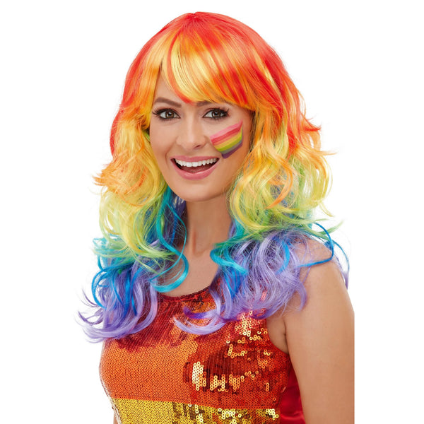 Woman wearing a colorful rainbow wig on a white background