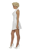 Side view of a woman wearing a white halter neck Marily Monroe dress on a white background