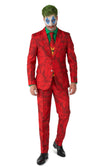 A person wearing a red suit with a pattern resembling the Joker's costume from the Batman series. The outfit includes a jacket, pants, and a tie.