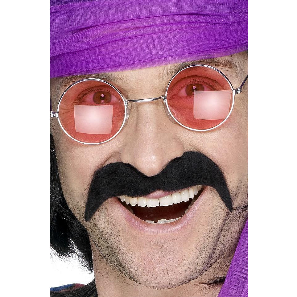A man wearing a black self-adhesive tash, also known as a mustache, paired with a purple bandana and orange round glasses.