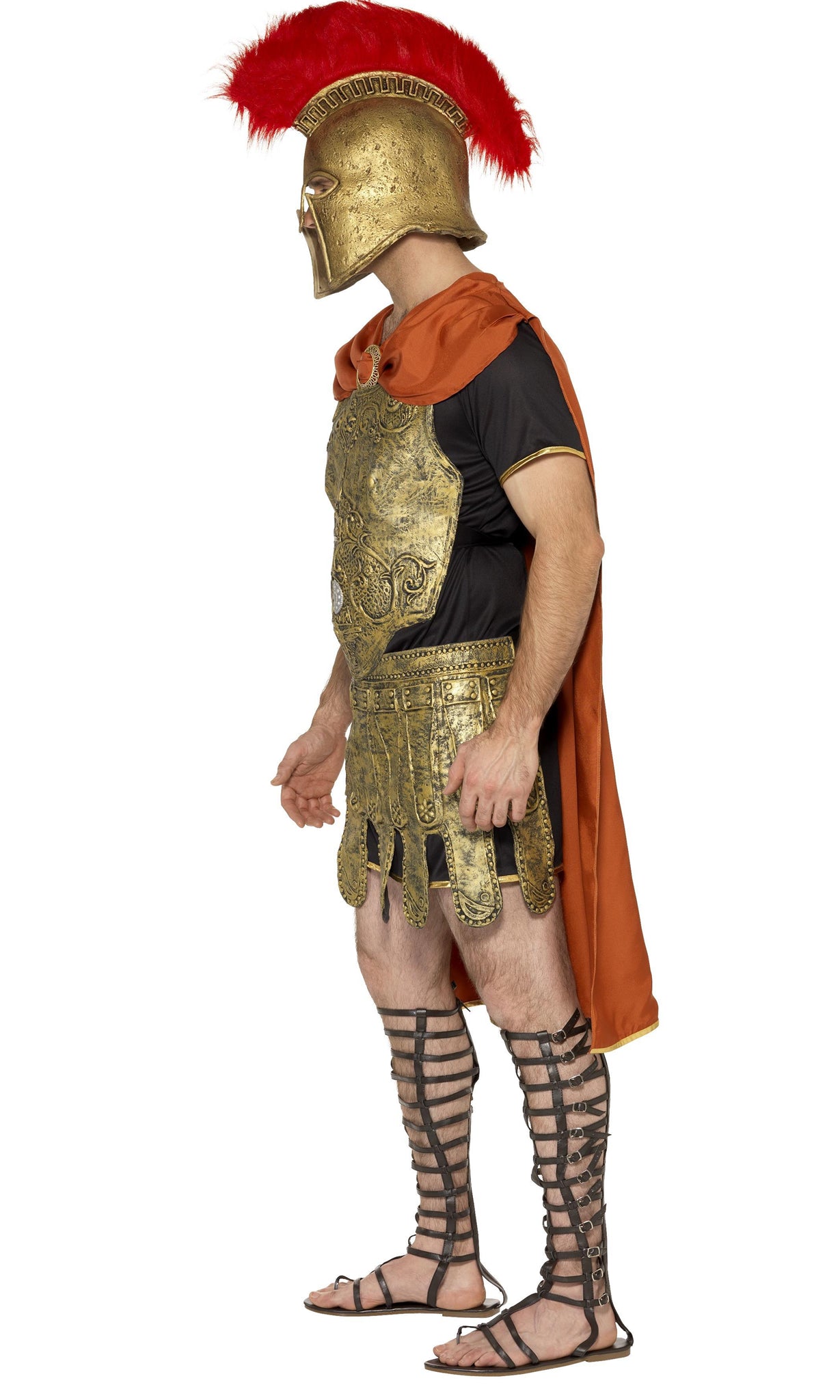 Side view of a man wearing a golden gladiator costume with helmet and red cape