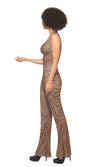 Side view of a woman wearing a leopard print jumpsuit costume, looking like Mel B.