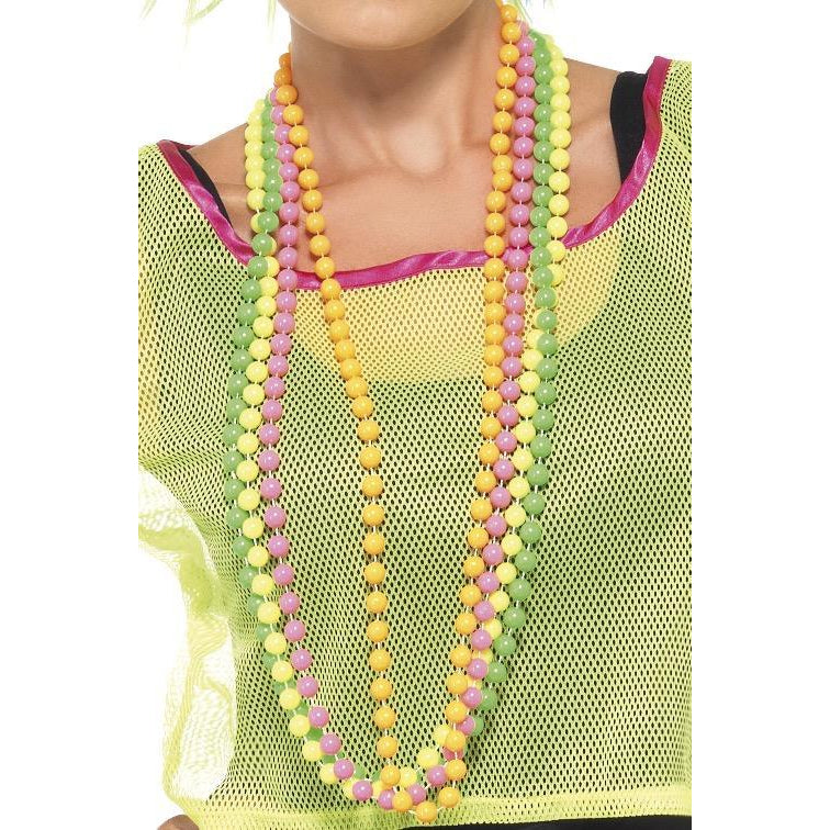 Four strings of neon pearls worn by a female in a 1990s style top neon green mesh top