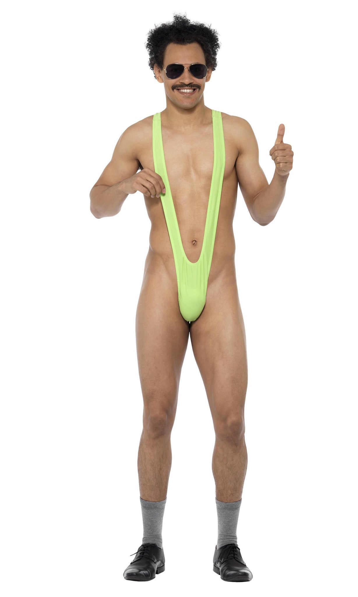 A man wearing a green Borat mankini, accessorized with sunglasses, against a white background.