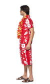 Side view of a man wearing a red Hawaiian costume with a lei, consisting of a short-sleeved shirt and matching shorts, standing against a white background.