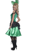 Side view of a model wearing a green and black western saloon girl costume with a corset top and attached petticoat, wearing black stockings.
