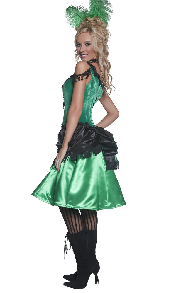 Side view of a model wearing a green and black western saloon girl costume with a corset top and attached petticoat, wearing black stockings.