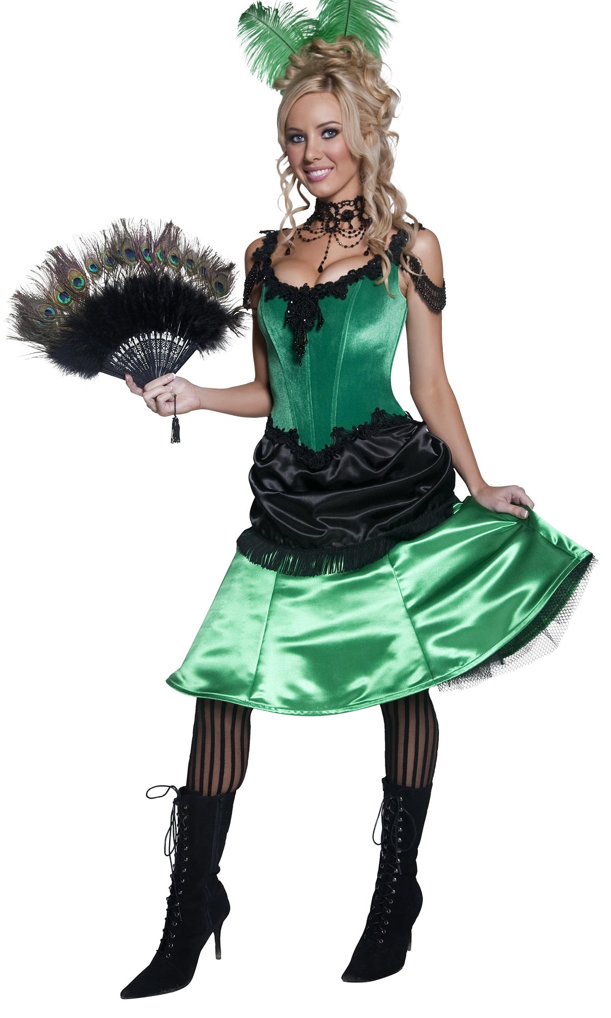A model wearing a green and black western saloon girl costume with a corset top and attached petticoat, holding a fan and wearing black stockings.
