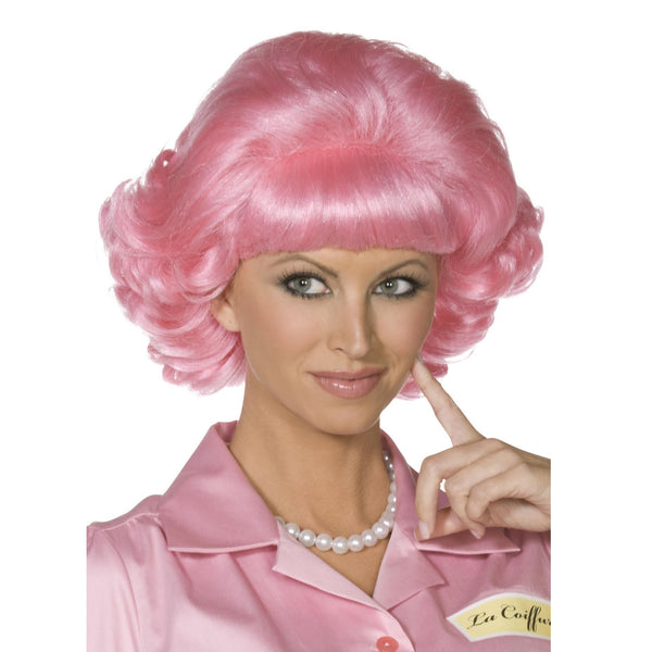 Pink Frenchy Grease 1950s flick wig worn by a woman in a pink 50s shirt with pearl necklace