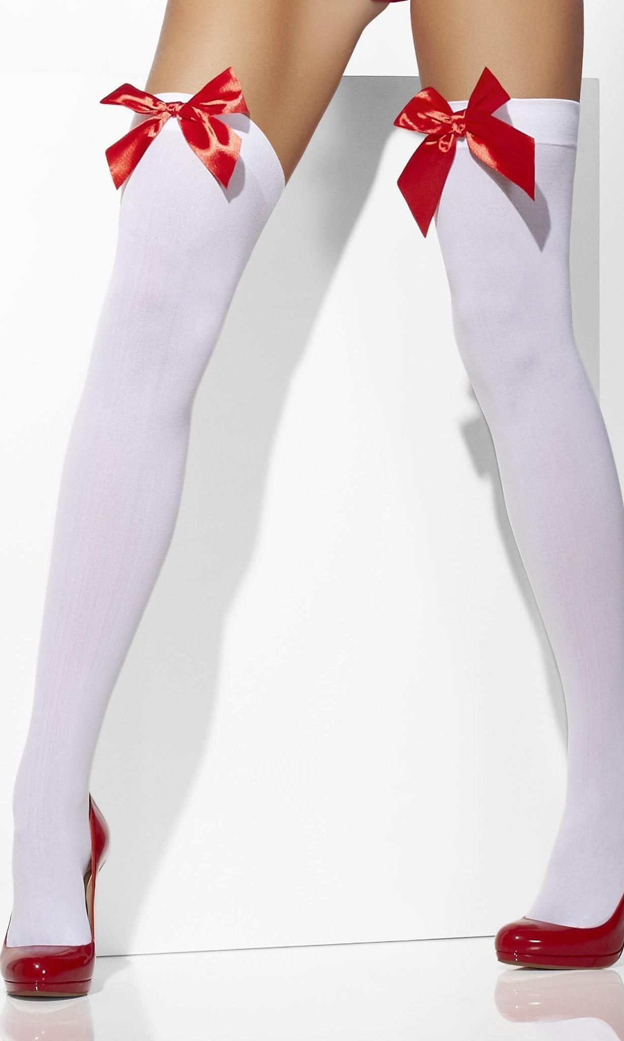 White thigh high stockings with red bow shown by a woman in a wide stance