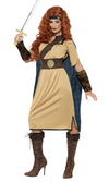 A woman modeling a Scottish warrior costume with a beige dress, brown belt, headband, and arm cuffs, holding a sword.