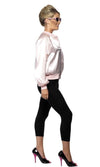 Side view of a woman wearing a silky pink ladies Grease jacket with logo stating Pink Ladies