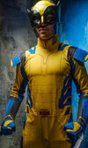 Man wearing a yellow and blue Wolverine costume