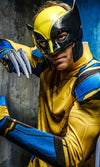 Man wearing a yellow and blue Wolverine costume