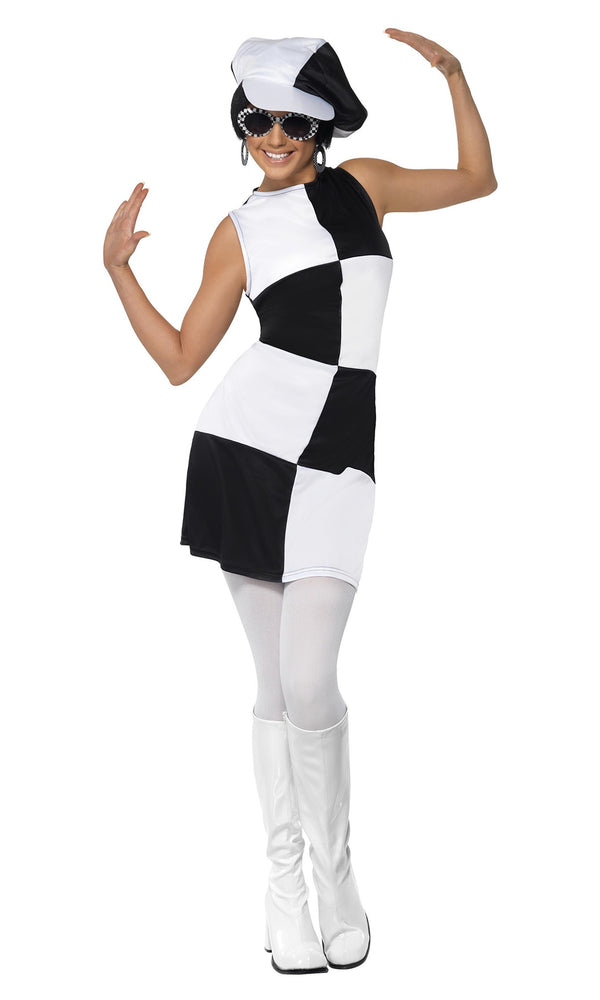 Woman wearing a black and white checkered dress with a hat on a white background