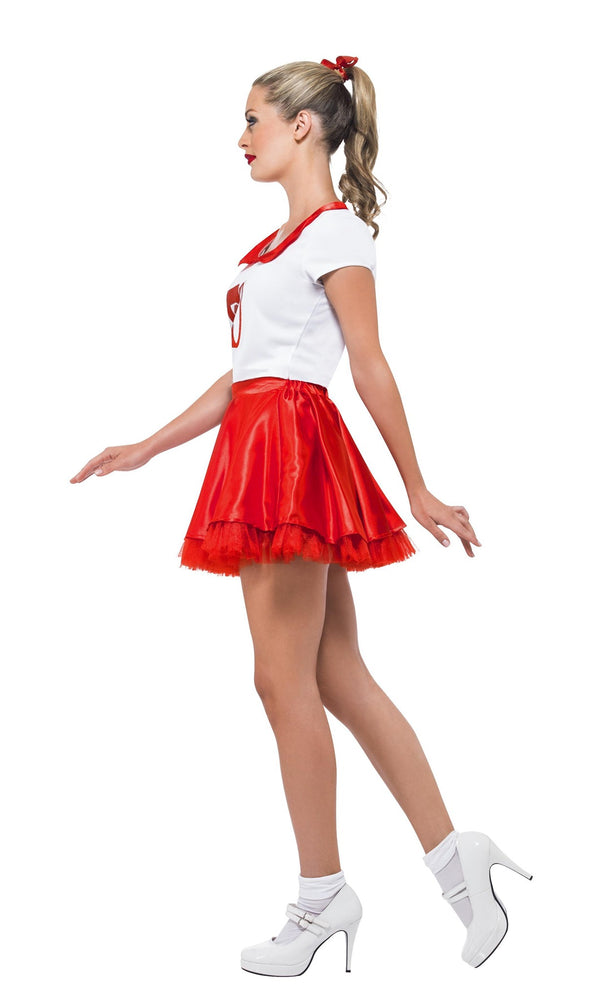Woman wearing a red and white costume with a skirt on a white background