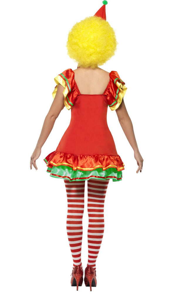 Back of a woman wearing a clown costume with a red dress, yellow wig, and striped tights on a white background