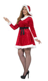 Side of a woman wearing a red Santa Claus costume with white trim and fishnet stockings