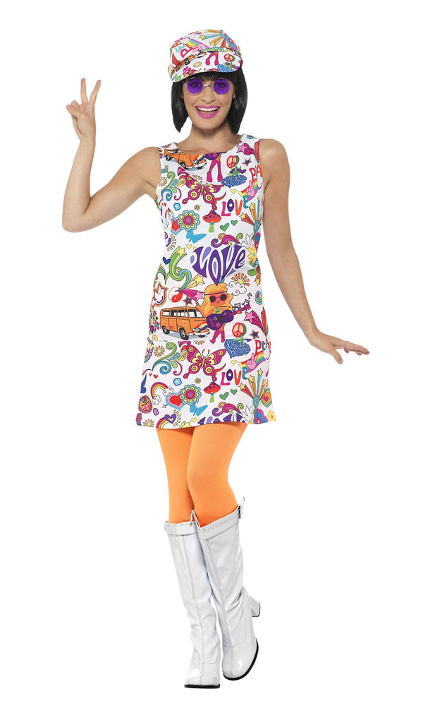 Woman wearing a colorful 1960s-themed dress with peace signs, flowers, and 'Love' text on a white background.