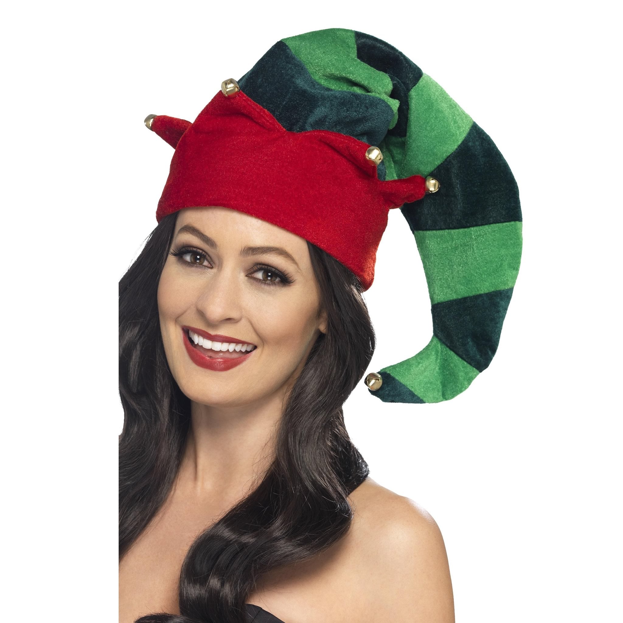 Woman wearing a red and green elf hat with gold bells on a white background