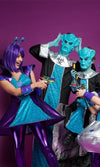 A family dressed in purble and blue alien costumes holding laser guns