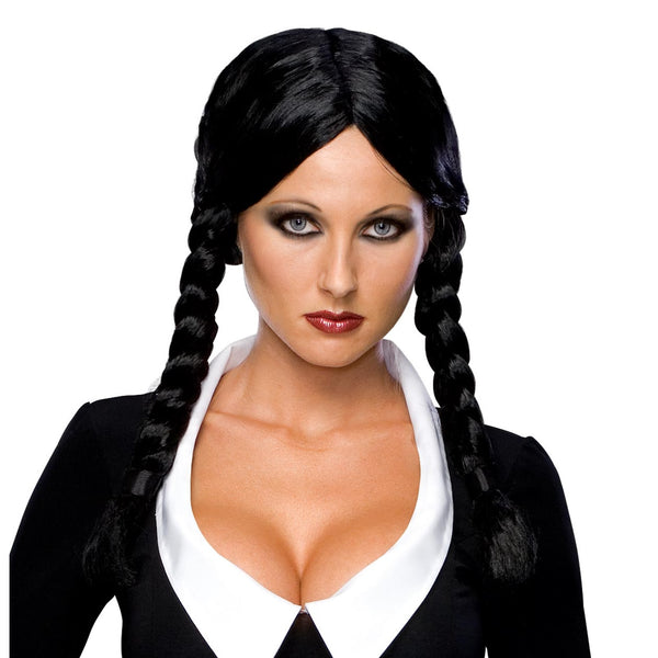 A woman wearing a black braided wig styled like Wednesday Addams, paired with a black and white costume top.