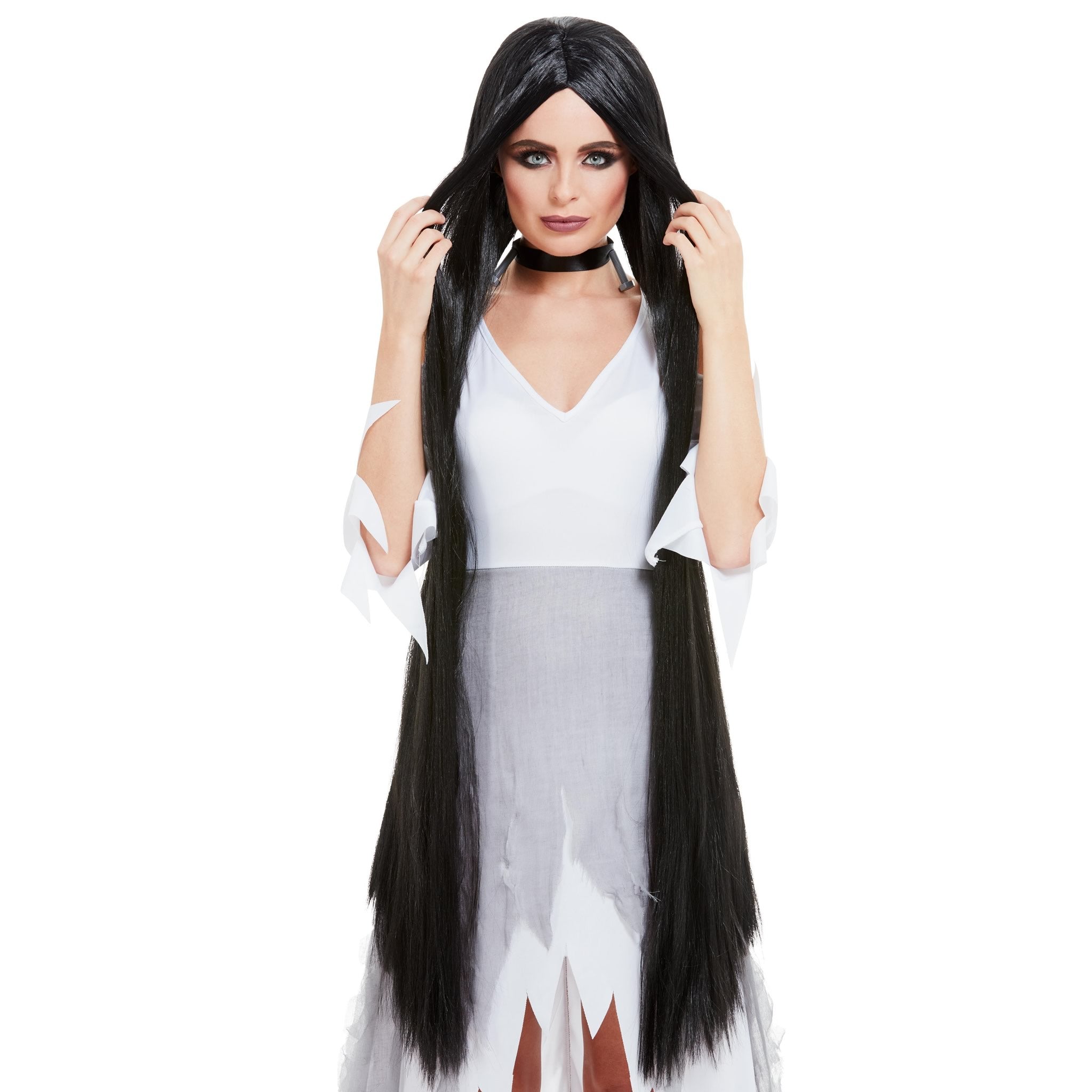 Woman wearing a very long black wig on a white background