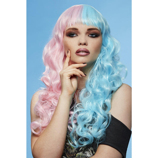 Woman with a pink and blue wig against a light blue background