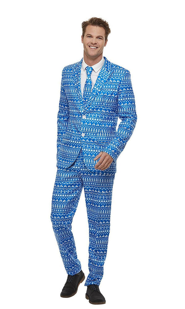 Man wearing a blue patterned Christmas suit on a white background