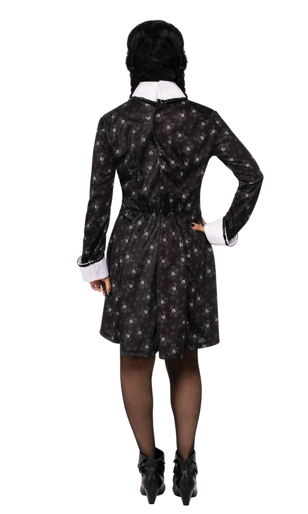Back of short black Wednesday Addams dress with small skull print and white cuffs and collar
