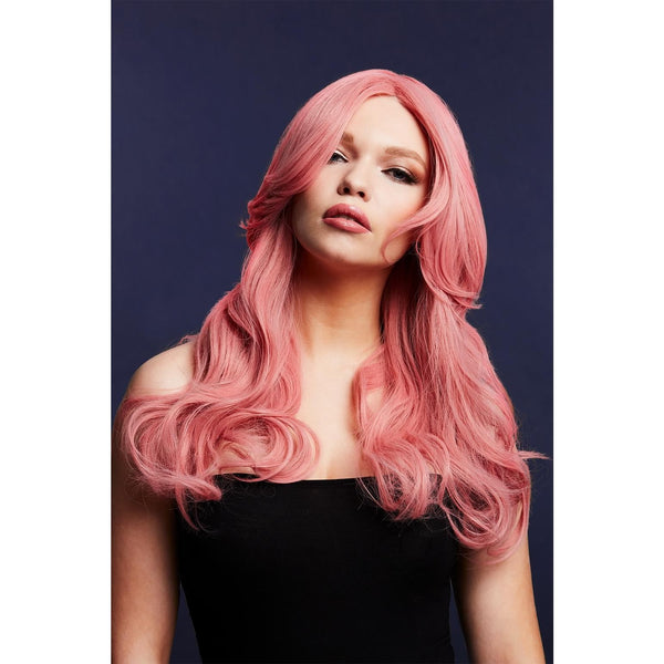 Woman with a long pink wig against a dark background