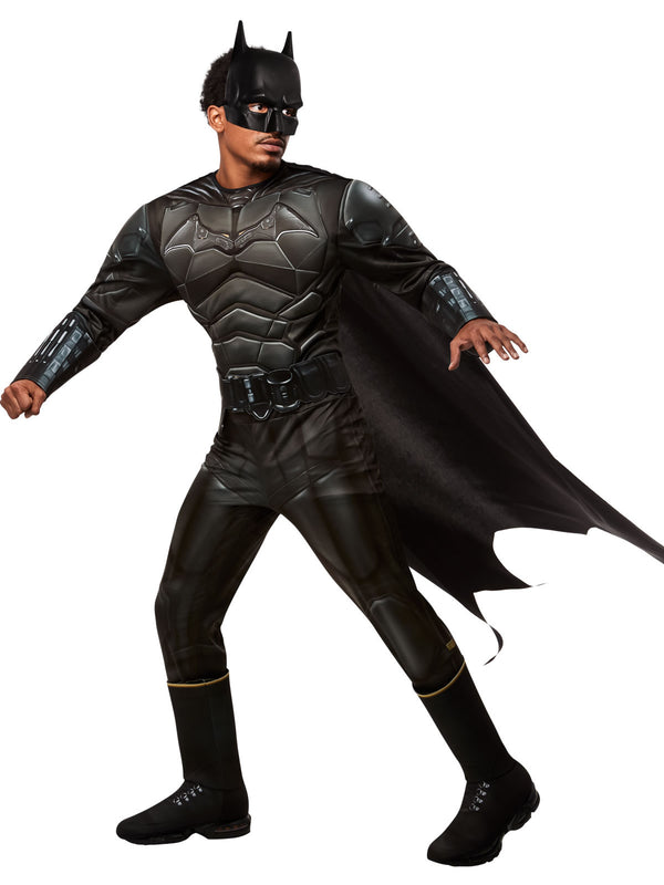 A man wearing a detailed Batman costume