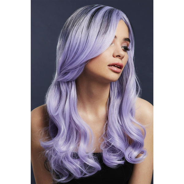 Woman with long, wavy, light purple hair against a dark background
