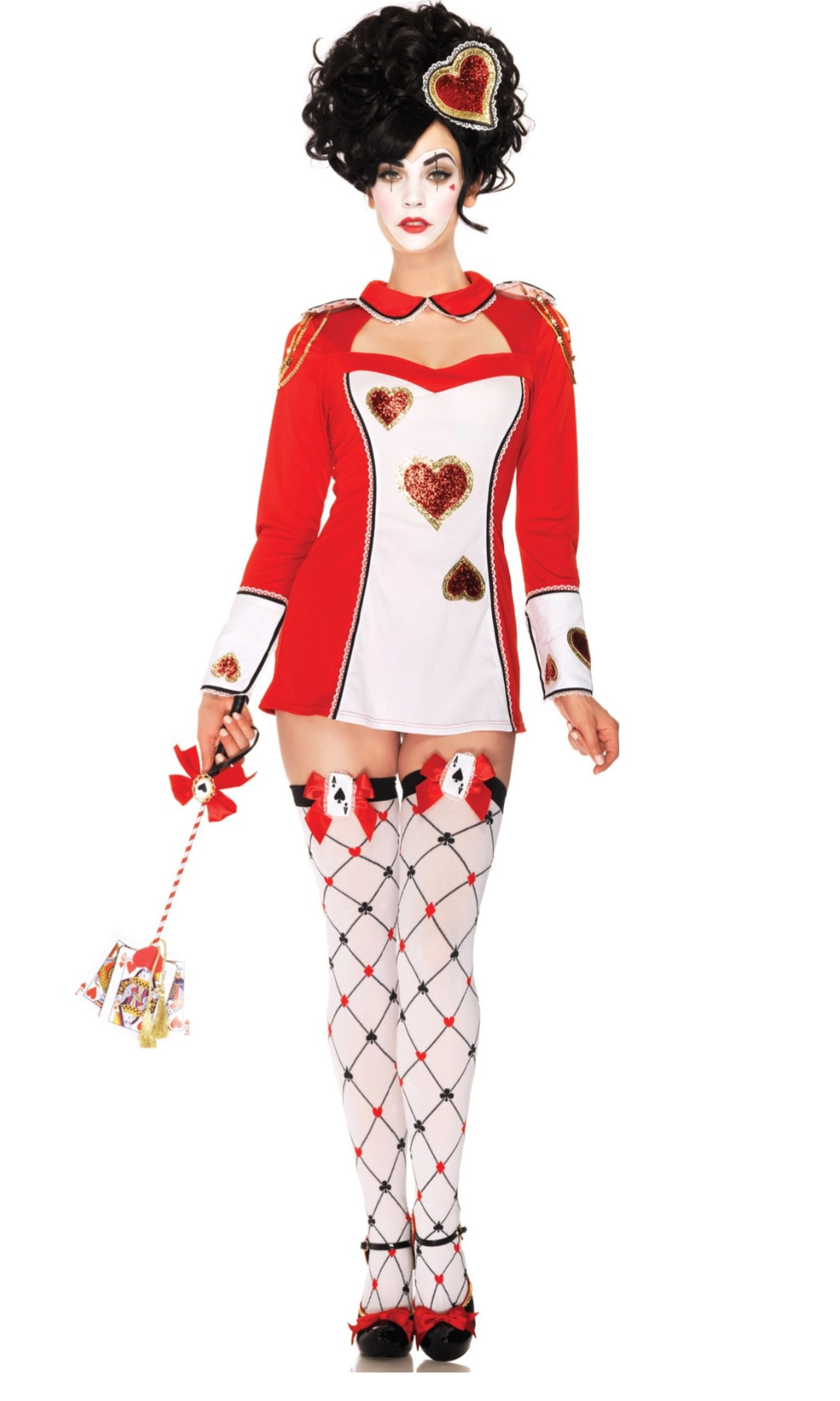 A woman modeling a red and white Queen of Hearts costume against a plain white background. The costume includes a long-sleeve red and white top with heart motifs, a matching skirt, black-and-white harlequin patterned thigh-high stockings, and a black wig with a heart headpiece.