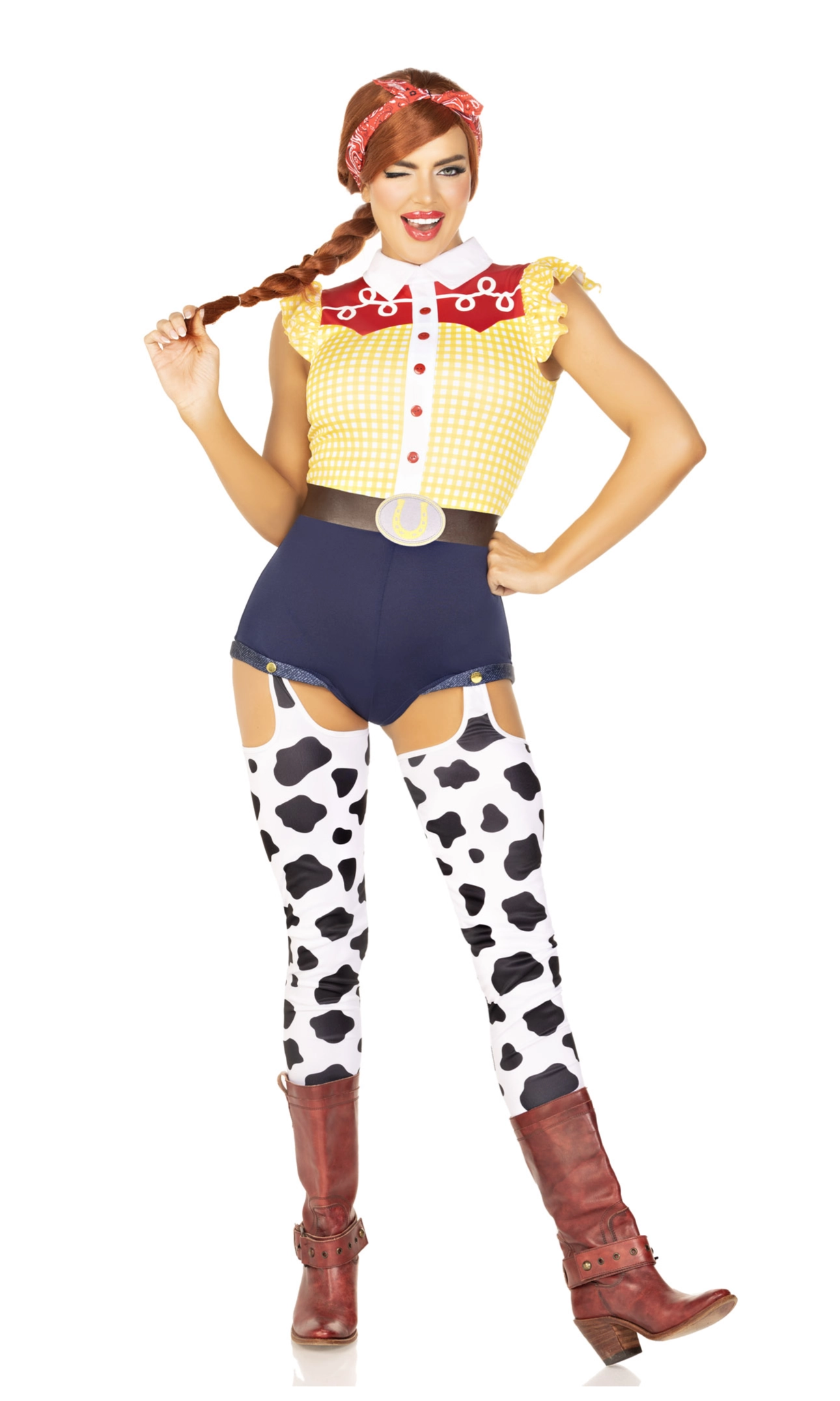 A woman modeling a Woody-inspired costume. The costume includes a yellow gingham top with red trim, dark blue shorts, white thigh-high stockings with black cow-print spots, and brown boots.