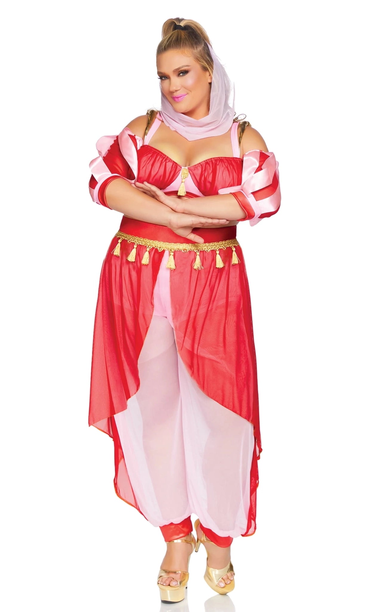 A woman modeling a pink and red genie-style costume with a matching headscarf, gold tassel belt, and gold heels.
