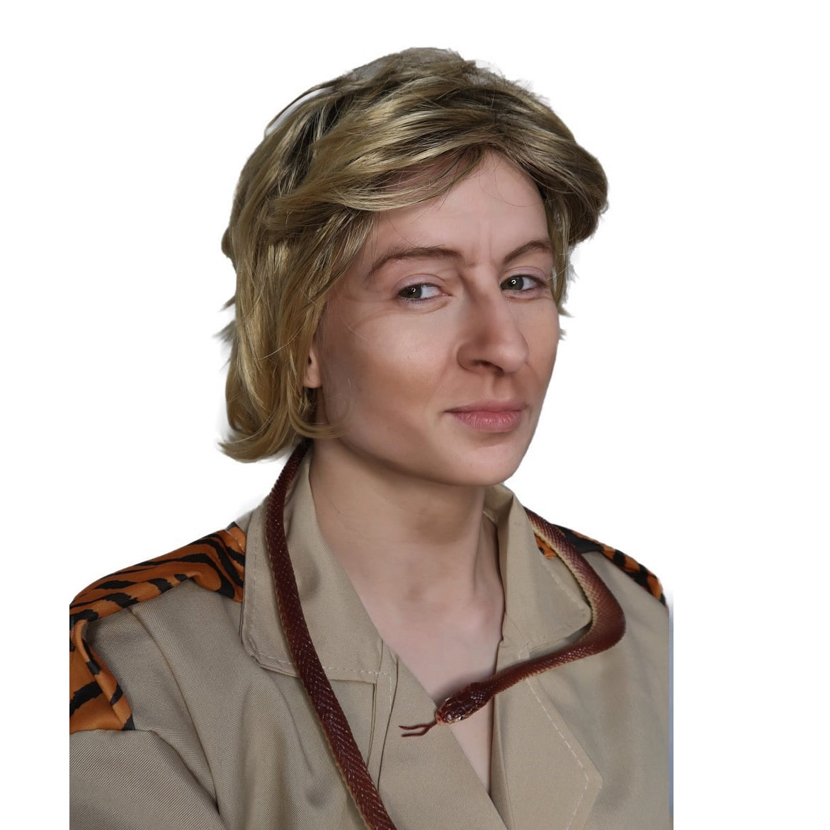 Person wearing a Steve Irwin style wig and a beige safari uniform with a snake