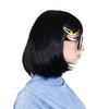 Side of a woman with a black bob wig and glasses wearing a blue shirt and yellow hair clip