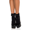 Black platform ankle boots with ruffled lace cuffs, shown on a model's feet