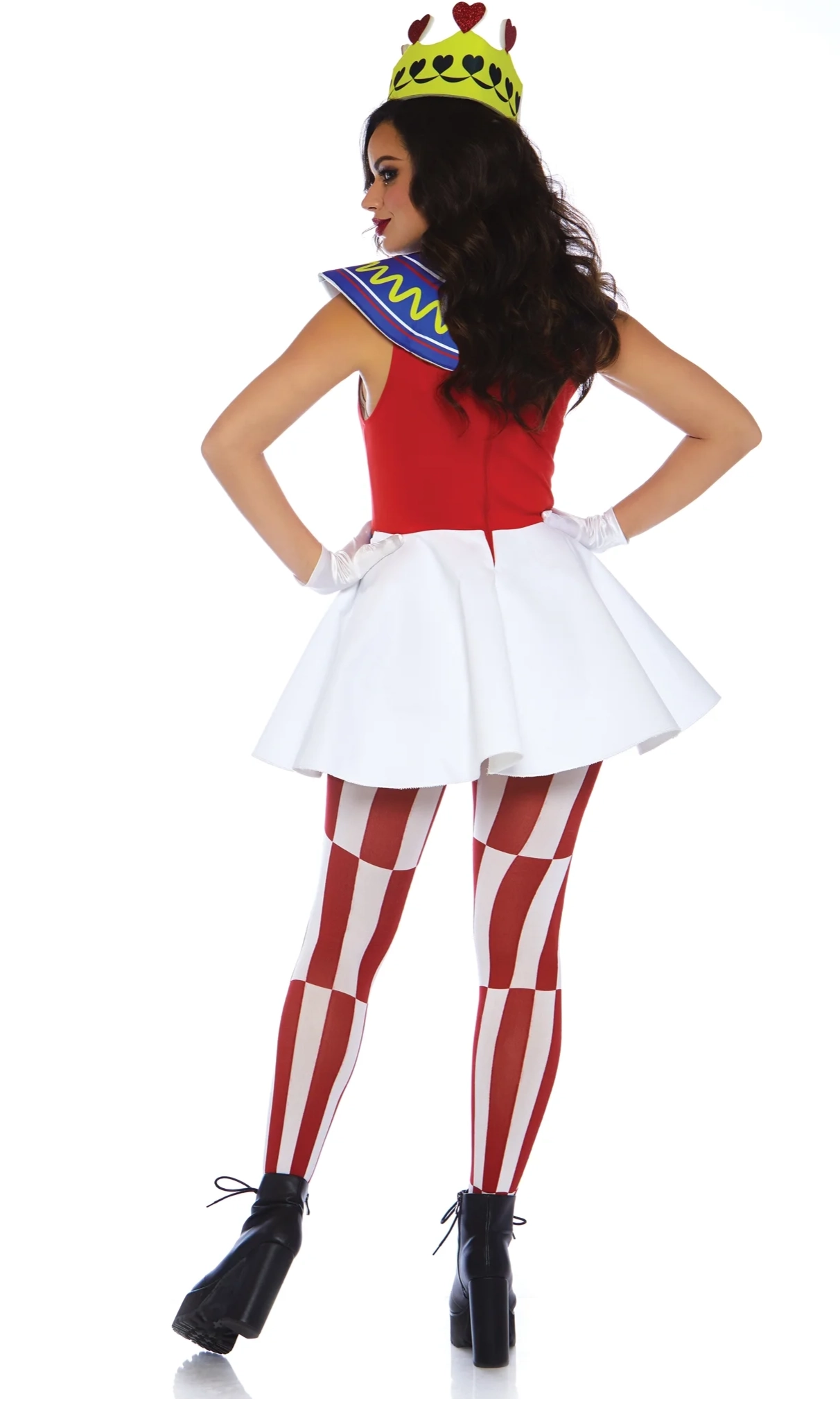 A woman modeling a red and white costume dress with a white flared skirt, red and white striped tights, a blue and yellow sash, and a yellow crown with red hearts, shown from the back.