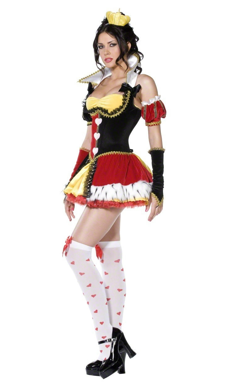 Side view of a woman wearing a short red, black, and yellow queen costume with heart-themed accessories