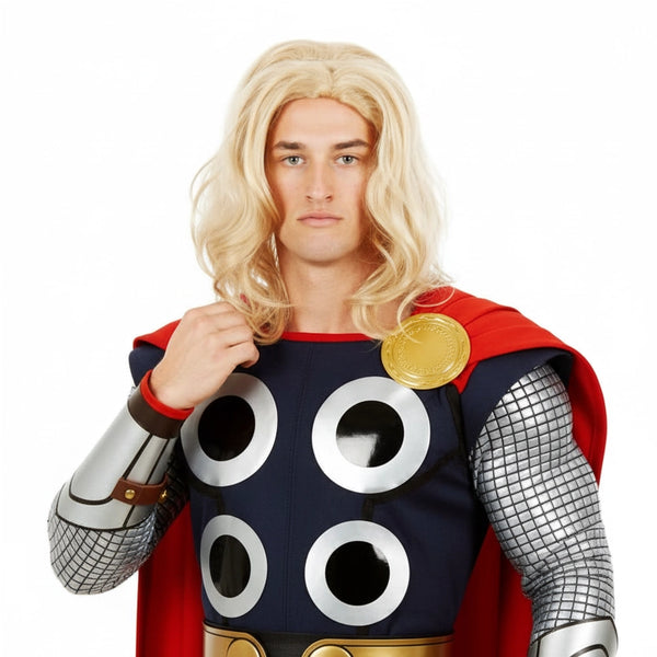 A man wearing a Thor costume with a blonde wig, blue and red armor, silver chainmail sleeves, and a gold chest piece.