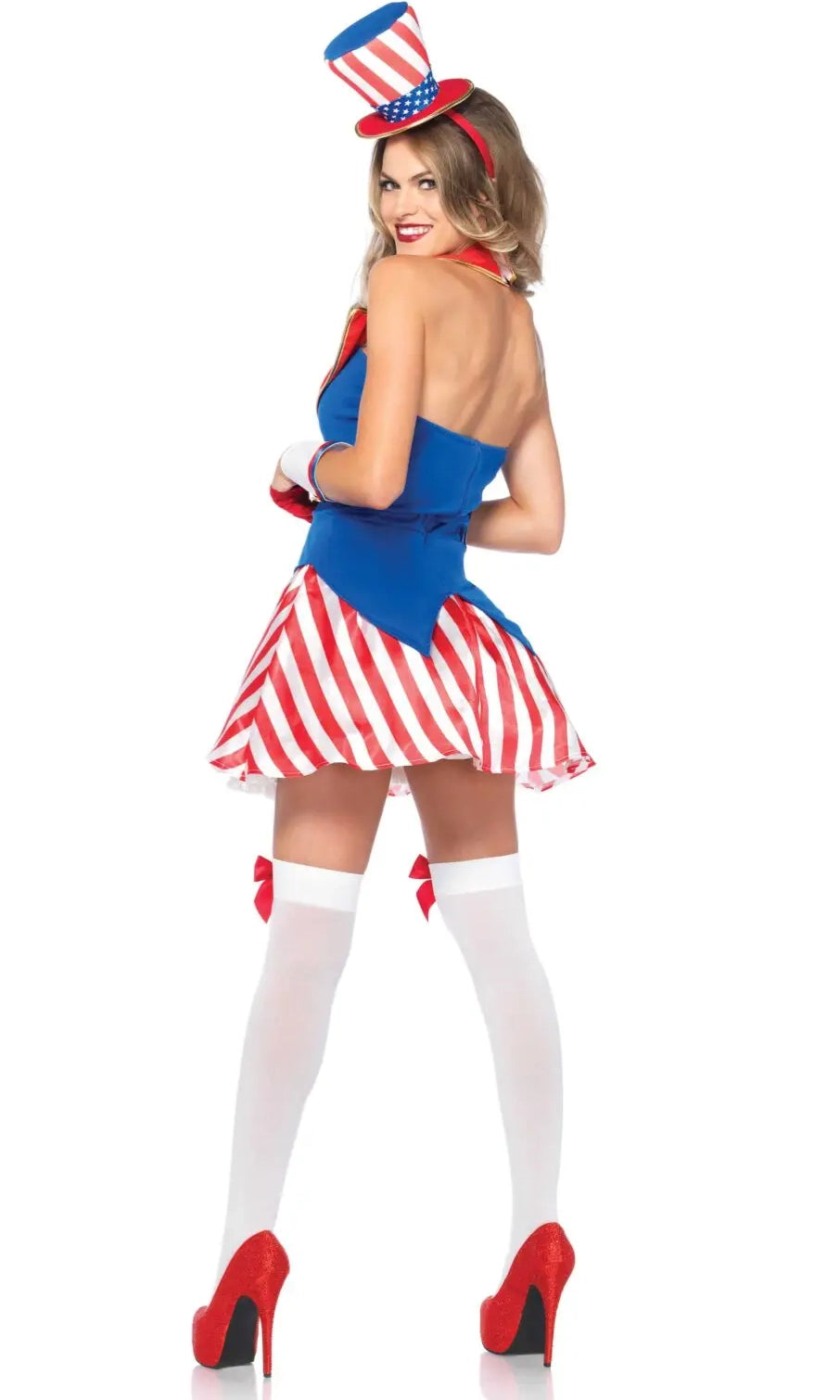 A woman modeling a patriotic Uncle Sam costume. The costume includes a blue top, a red and white striped skirt, a matching red, white, and blue top hat, white thigh-high stockings with red bows, and red high heels.