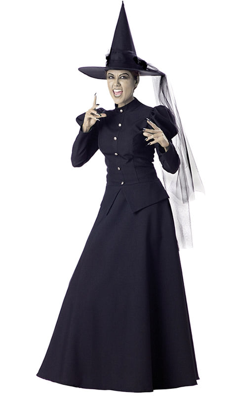 A woman in a long black Wicked Witch costume with pointed hat with veil