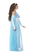 Side of a woman in a long blue medieval dress with arm drapes and headband