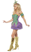 Side view of a woman wearing a purple and green short jester dress with matching jester hat and golden boots