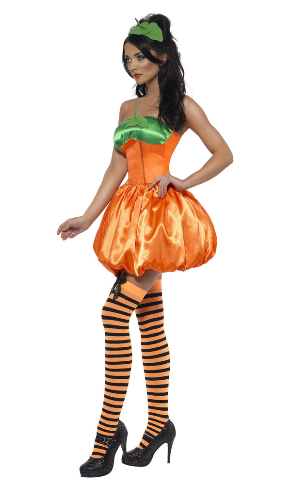 Side of short orange and green pumpkin dress with headband