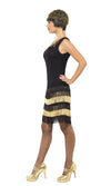 Side of black flapper dress with gold and black tassels